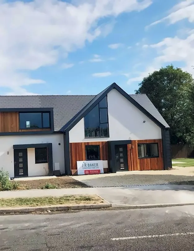 Pair of new houses in render, brick and timber cladding, Kings Worthy