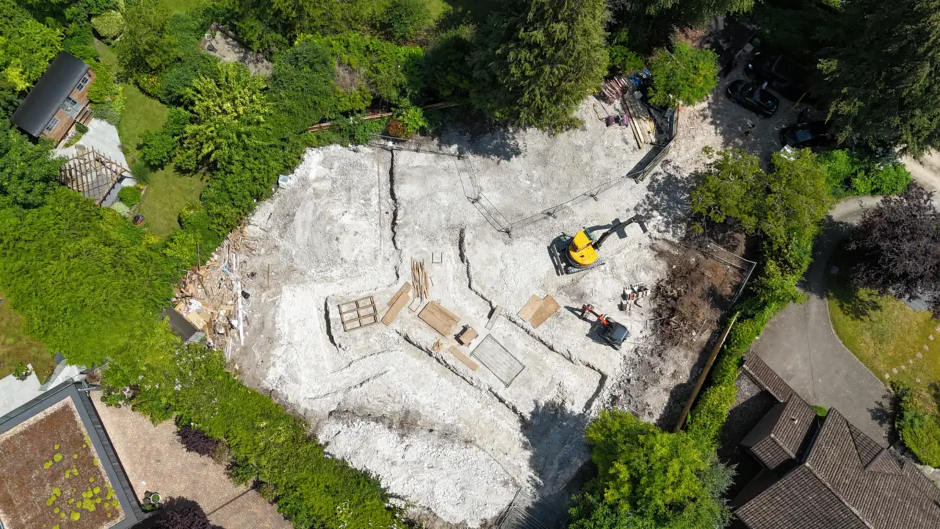 The cleared site from above, with root protection to the retained trees