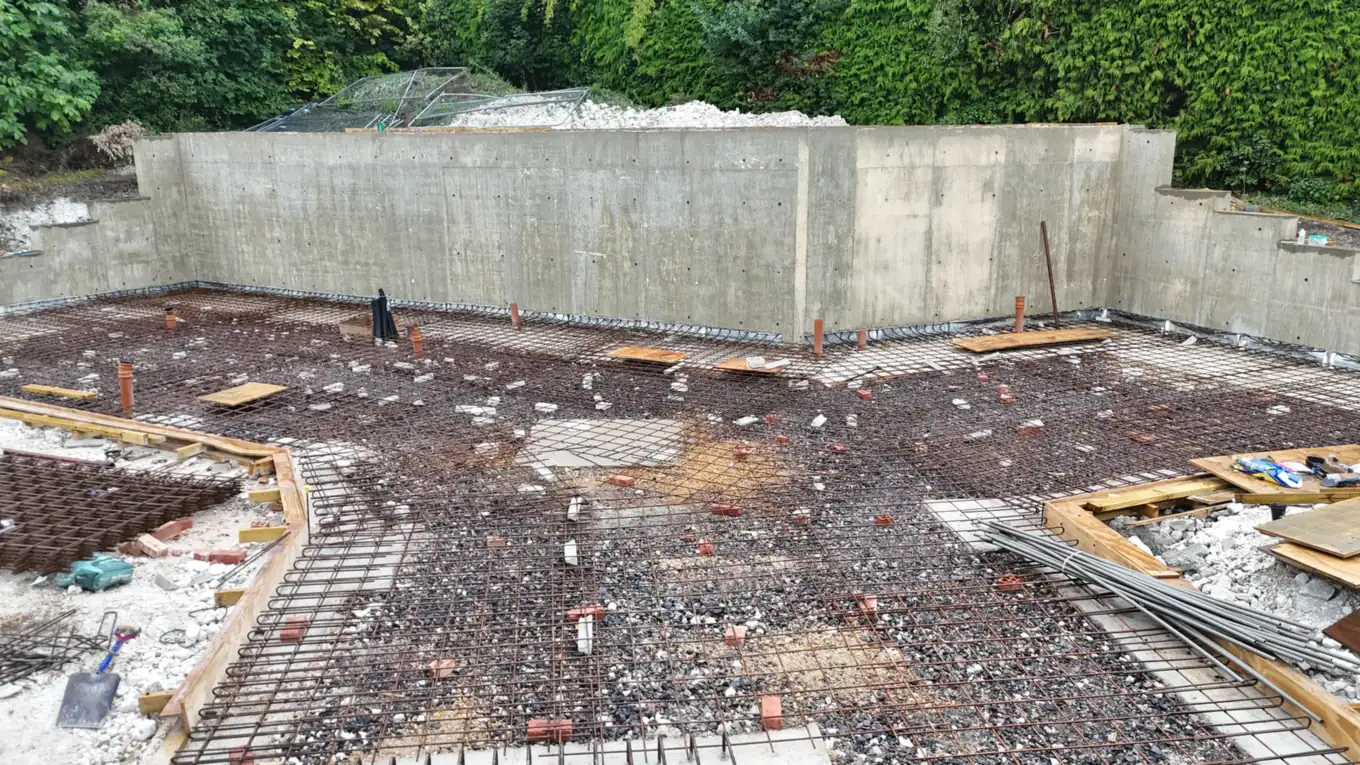 Retaining walls poured in situ, with the slab reinforcement laid ahead of the pour
